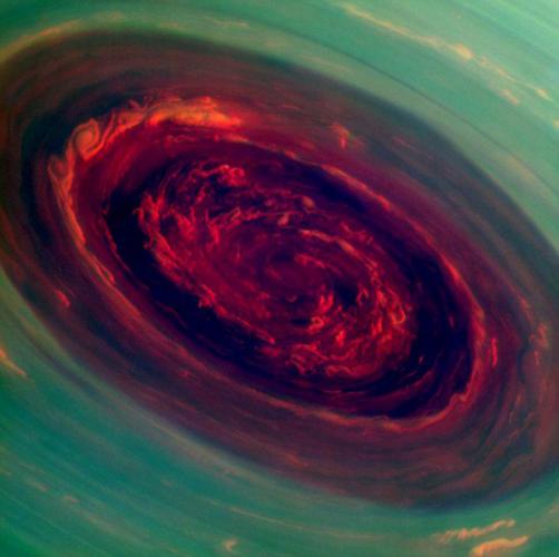 This handout image released by NASA/JPL-Caltech/SSI on April 29, 2013 shows a false-color image from NASA's Cassini mission, of the spinning vortex of Saturn's north polar storm resembling a deep red rose of giant proportions surrounded by green foliage. Measurements have sized the eye at a staggering 1,250 miles (2,000 kilometers) across with cloud speeds as fast as 330 miles per hour (150 meters per second). == RESTRICTED TO EDITORIAL USE / MANDATORY CREDIT: "AFP PHOTO / NASA/JPL-Caltech/SSI / NO MARKETING / NO ADVERTISING CAMPAIGNS / DISTRIBUTED AS A SERVICE TO CLIENTS ==HO/AFP/Getty Images